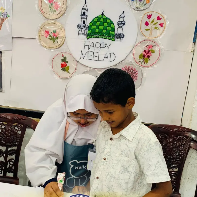Children sharing a craft activity at Al-Jannah Centre
