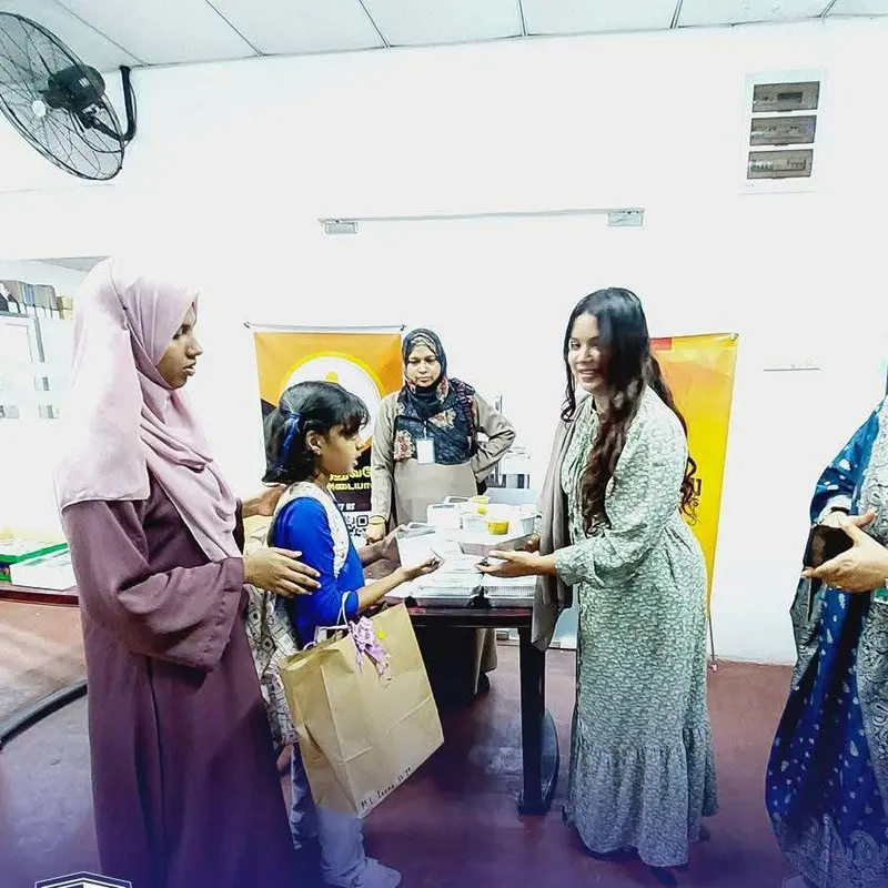 A child receiving a gift at a Centre event